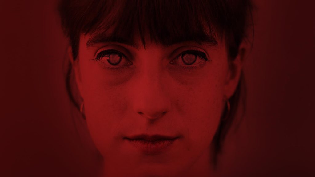Portrait of woman through a red filter
